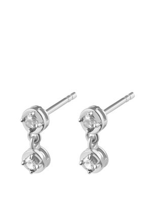 Silver-tone drop earrings featuring two linked circular settings, each with a clear gemstone, showcasing a sleek, polished design.