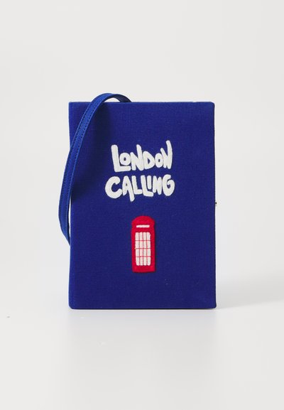 Blue fabric bag with "LONDON CALLING" embroidered in white, featuring a red British phone booth design. Adjustable strap included.