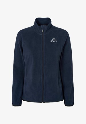 Marineblå fleecejakke med glidelås foran, høy krage og logo på venstre bryst. Har sidelommer og elastiske mansjetter.