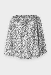 Blomstrete bluse med et svart og hvitt mønster, med avslappet passform, elastisk halslinning og korte ermer. Lett stoff gir god ventilasjon.