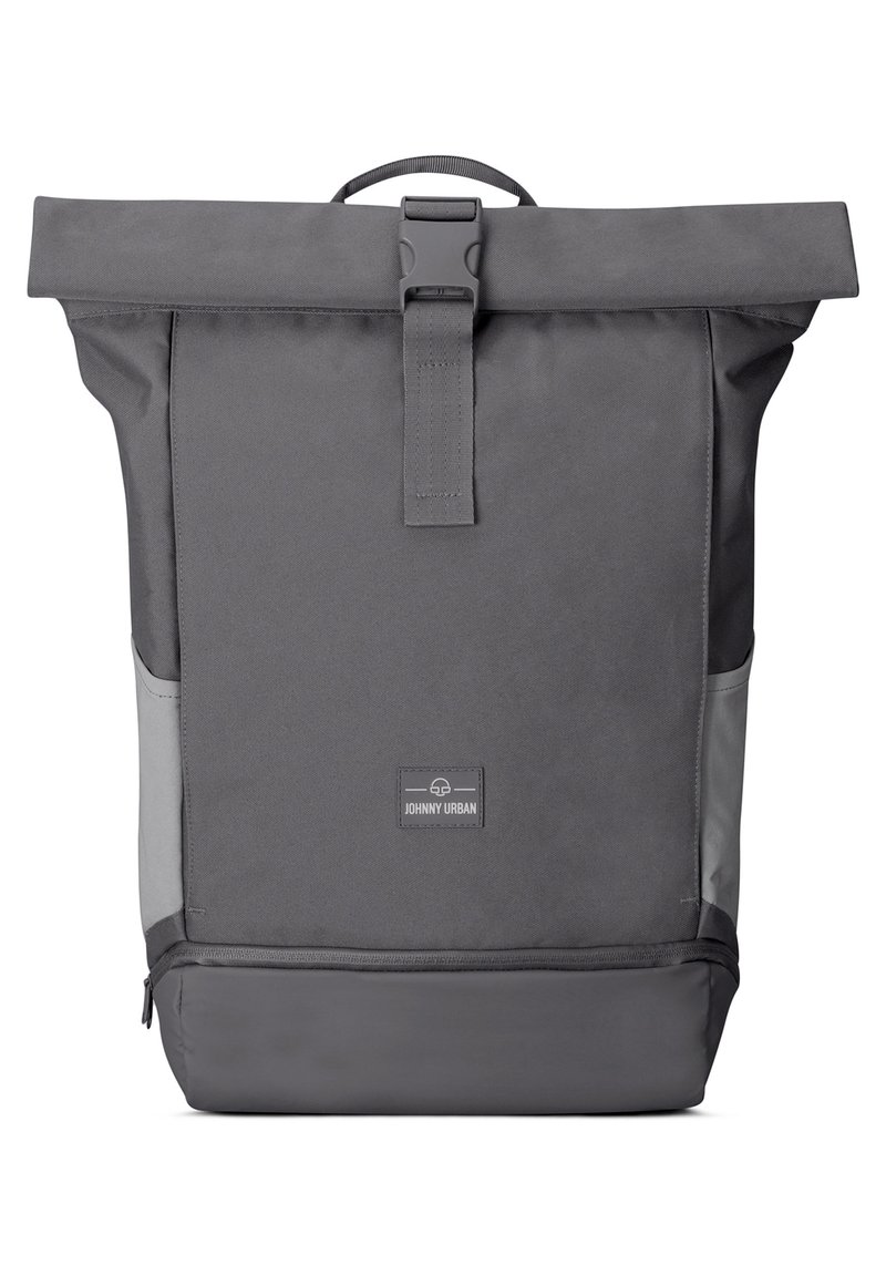 Gray roll-top backpack made of durable nylon, featuring a buckle closure, side pockets, a textured surface, and a logo patch on the front.