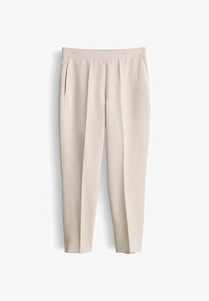Lichtbeige, op maat gemaakte pantalon met een platte voorkant, zijzakken en een slanke taps toelopende pasvorm. Glad, zacht stof met een subtiele textuur.