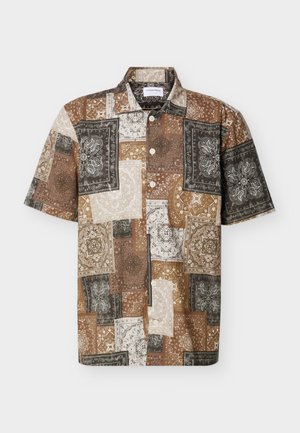 Short-sleeve button-up shirt with patchwork bandana print in brown, beige, black, and white tones, featuring a collared neckline.