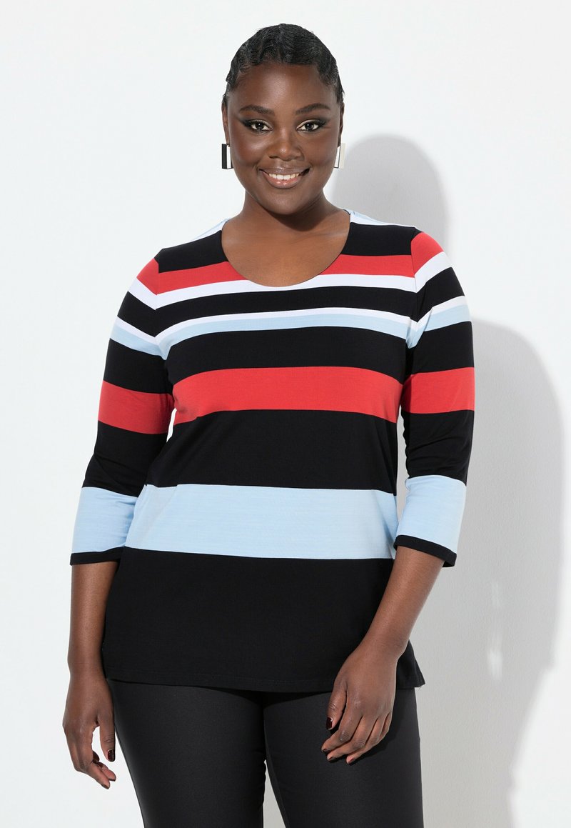 Musta-valko-raita pitkähihainen paita, jossa on punaisia ja vaaleansinisia vaakaraitoja; pyöreä pääntie; pehmeä ja joustava kangas; yhdistetty mustien housujen kanssa.