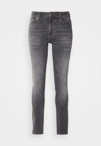 Jeans in denim grigio con una vestibilità slim, dotati di cinque tasche, lievi sfumature e una classica chiusura a bottoni.