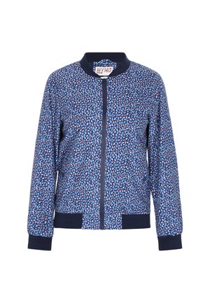 Navy bomber jacket featuring a multi-colored geometric pattern, with a front zipper, ribbed collar, and cuffs. Soft fabric texture.