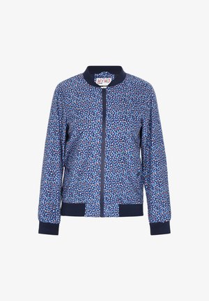 Navy bomber jacket featuring a multi-colored geometric pattern, with a front zipper, ribbed collar, and cuffs. Soft fabric texture.