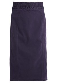 Lilla knælang nederdel lavet af bomuld med elastisk talje og sidesømme. Glat tekstur uden yderligere mønstre eller detaljer.