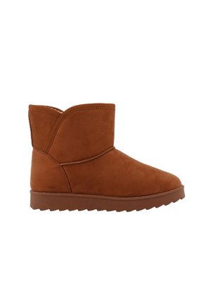 Brown suede ankle boot with rounded toe, flat rubber sole, and stitched detailing along the upper and heel.