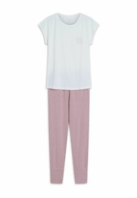 Biała bluzka z krótkim rękawem z delikatnym nadrukiem oraz różowe spodnie od piżamy w kropki z elastycznymi mankietami. Miękka, przewiewna tkanina.