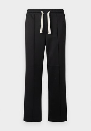Schwarze Sweatpants mit einem kremfarbenen Kordelzugbund. Hergestellt aus einem glatten Material, mit geraden Beinen und ohne sichtbare Taschen.