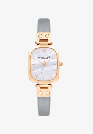 Reloj rectangular con caja de metal color oro rosa, correa de cuero texturizado gris y esfera de nácar con marcadores de hora dorados.