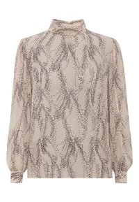 Blusa beige chiaro con colletto alto, decorata con un motivo astratto a pois neri e maniche lunghe a sbuffo gatherate ai polsi. Tessuto liscio e trasparente.