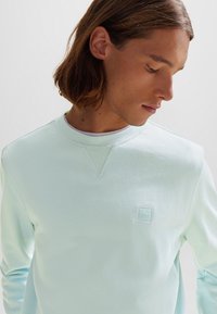 BOSS Melegítőfelső - turquoise aqua