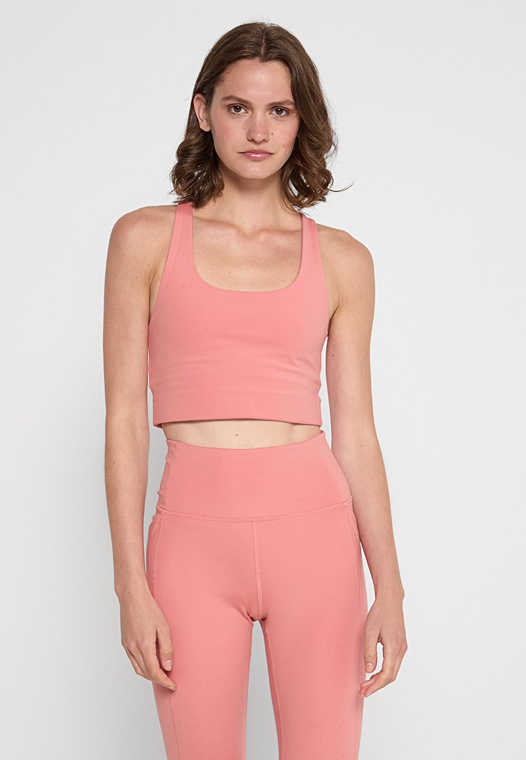 Girlfriend Collective Sport-bh met medium support roze Girlfriend Collective Sport-bh met medium support roze