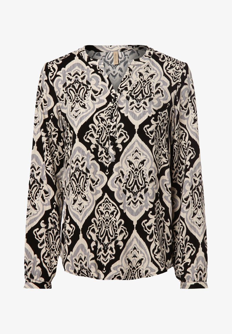 Blouse à manches longues avec un motif en losange orné de grande taille en noir, blanc et gris, et une patte de boutonnage partielle à l'avant.