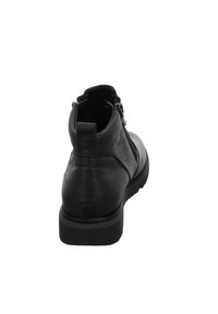 Schwarze Lederknöchelstiefel mit seitlichem Reißverschluss, runder Spitze, strukturierter Oberfläche und Gummisohle mit gerippter Musterung für besseren Halt.
