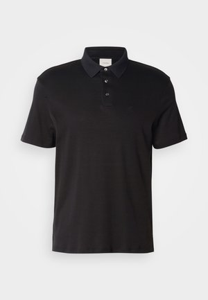Polo nero in cotone, con colletto classico, patta con tre bottoni, maniche corte e un logo discreto sulla parte anteriore.