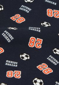 Navy fabric featuring a repeated pattern of white and black soccer balls and the text "FUTURE LEGEND" in white, and numbers "28" and "82" in orange.