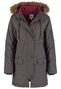Dark brown winter parka with fur-trimmed hood, maroon inner lining, front snap buttons, zip closure, and flap pockets on the front.