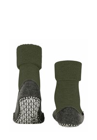 Calze verdi lavorate a maglia con una parte superiore testurizzata, tallone in feltro grigio a contrasto e suola in gomma bianca con grip che presenta un motivo geometrico.