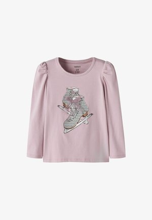 Light pink long-sleeve shirt with puffed shoulders and a central graphic of vintage-style gray ice skates tied with a pink bow.