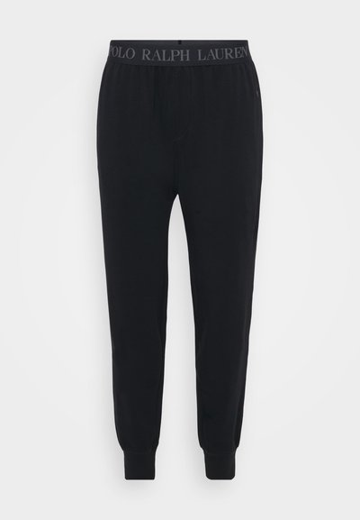 Melni kokvilnas sporta bikses ar elastīgu jostasvietu un "POLO RALPH LAUREN" logo, ar sašaurinātām kājām un ribotām piedurknēm.