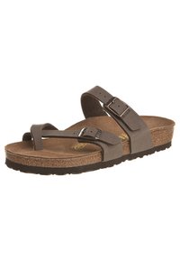 Brun korksåle sandal med to justerbare stropper med metallspenne, teksturert overflate og en solid svart gummisåle.