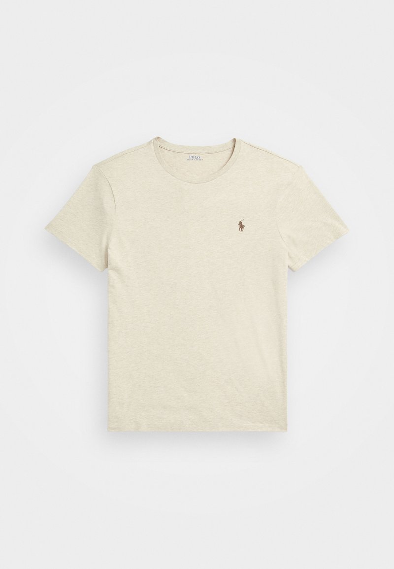 Beige színű pamut póló kerek nyakkal és rövid ujjal. Kicsi barna logó található a bal mellen. Puha tapintás, laza kialakítás.