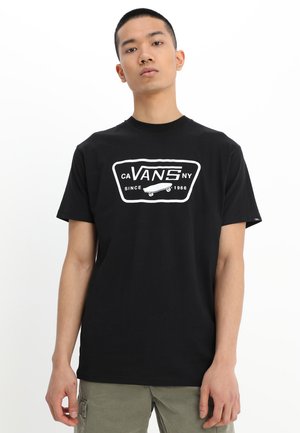 Black cotton t-shirt with white Vans logo and skateboard graphic. Classic round neck and short sleeves, featuring a relaxed fit.