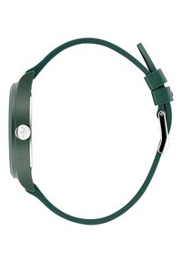 Montre en silicone verte avec un boîtier rond, un cadran blanc et une finition texturée. Comprend une couronne de couleur argentée et un bracelet adjustable assorti.