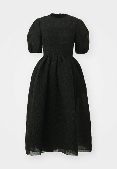 Black puff-sleeve dress made of textured fabric with a diamond pattern, featuring a round neckline and a flared skirt.