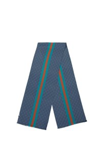 Écharpe tissée en bleu marine avec un motif texturé. Elle présente des rayures turquoises et rouille qui courent verticalement. Bords effilochés.