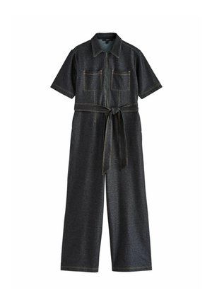 Dark gray short-sleeve jumpsuit with front zipper, two chest pockets, wide legs, and a tied fabric belt at the waist.