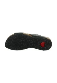 Schwarze Sandalensohle mit einer strukturierten Gummi-Oberfläche und Korkakzent. Verfügt über ein rotes Herzdetail in der Nähe der Ferse. Flaches, ergonomisches Design.
