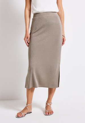Metallic taupe midi skirt with a fitted silhouette and side slit, made from a smooth, slightly textured fabric. Silver strappy sandals complete the look.