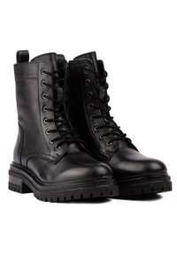 Black leather ankle boots with lace-up design, padded collar, and rubber sole. Features stitching detail and pull tab on the back.