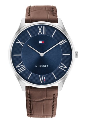 Silver-tone watch with a textured navy blue dial, Roman numeral markers, and brown crocodile-patterned leather strap. "HILFIGER" logo displayed.