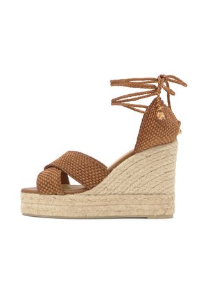 Brown woven wedge sandal with braided ankle ties and natural rope-covered platform sole.