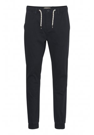 Marineblaue, schmal zulaufende Hosen aus leichtem Baumwollstoff mit elastischen Bündchen, einem Kordelzug an der Taille und Kontrastnähten.