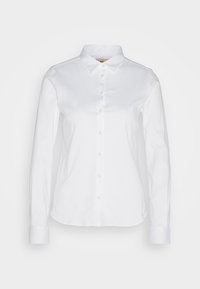 Chemise blanche à manches longues avec boutons, col et poignets, présentée sur un fond blanc uni.