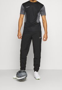 Nike Performance Träningsbyxor - black