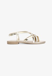 Seleccionado, gold-coloured