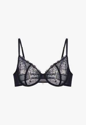 Svart blondesøyle med blomsterbroderi, justerbare stropper og bøyleunderstøttelse, vist på hvit bakgrunn.