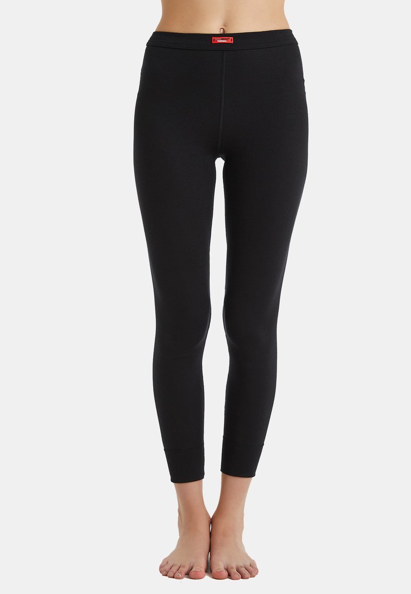 Leggings neri realizzati in un tessuto elasticizzato, con un design aderente, una cintura liscia e polsini aderenti alle caviglie.