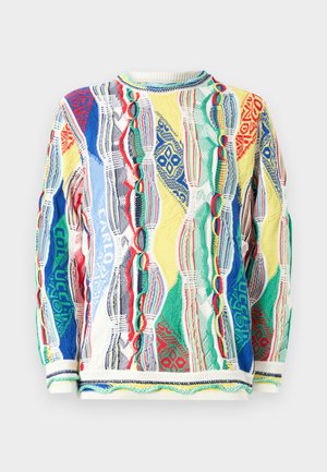 Strikket genser med livlige, flerfargede mønstre i rød, blå, grønn og gul. Ribbestrikket halslinning og mansjetter, teksturert stoff.