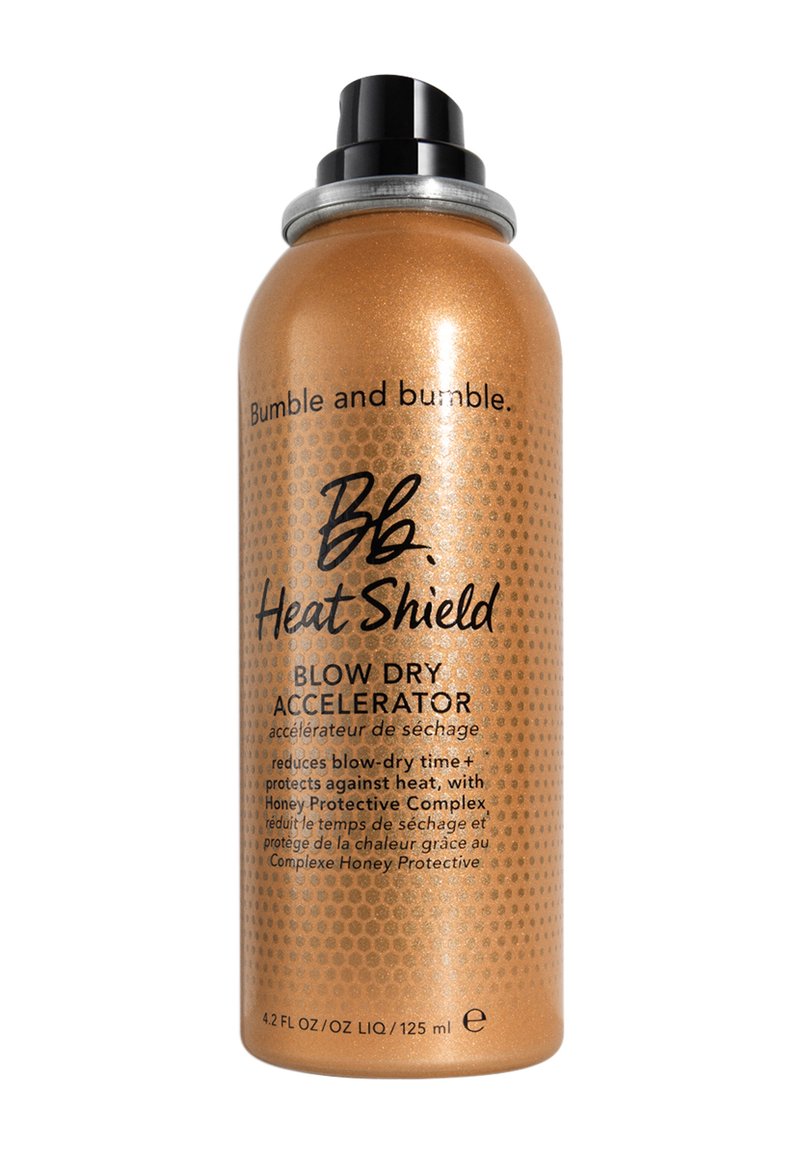 Bumble and bumble Heat Shield Blow Dry Accelerator dans un vaporisateur doré brillant, 4,2 oz, avec du texte noir et une buse noire.