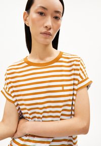 Short-sleeve T-shirt with white and mustard stripes, crew neckline, soft cotton fabric, featuring a small embroidered accent on the chest.