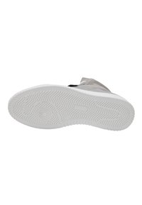 Shoe sole with a white rubber outsole featuring a zigzag pattern and circular detail. Upper part in gray fabric with contrasting accents.