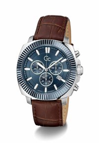 Reloj cronógrafo con esfera azul, caja en tono plateado y correa de cuero marrón con patrón de cocodrilo y mostrador de fecha.